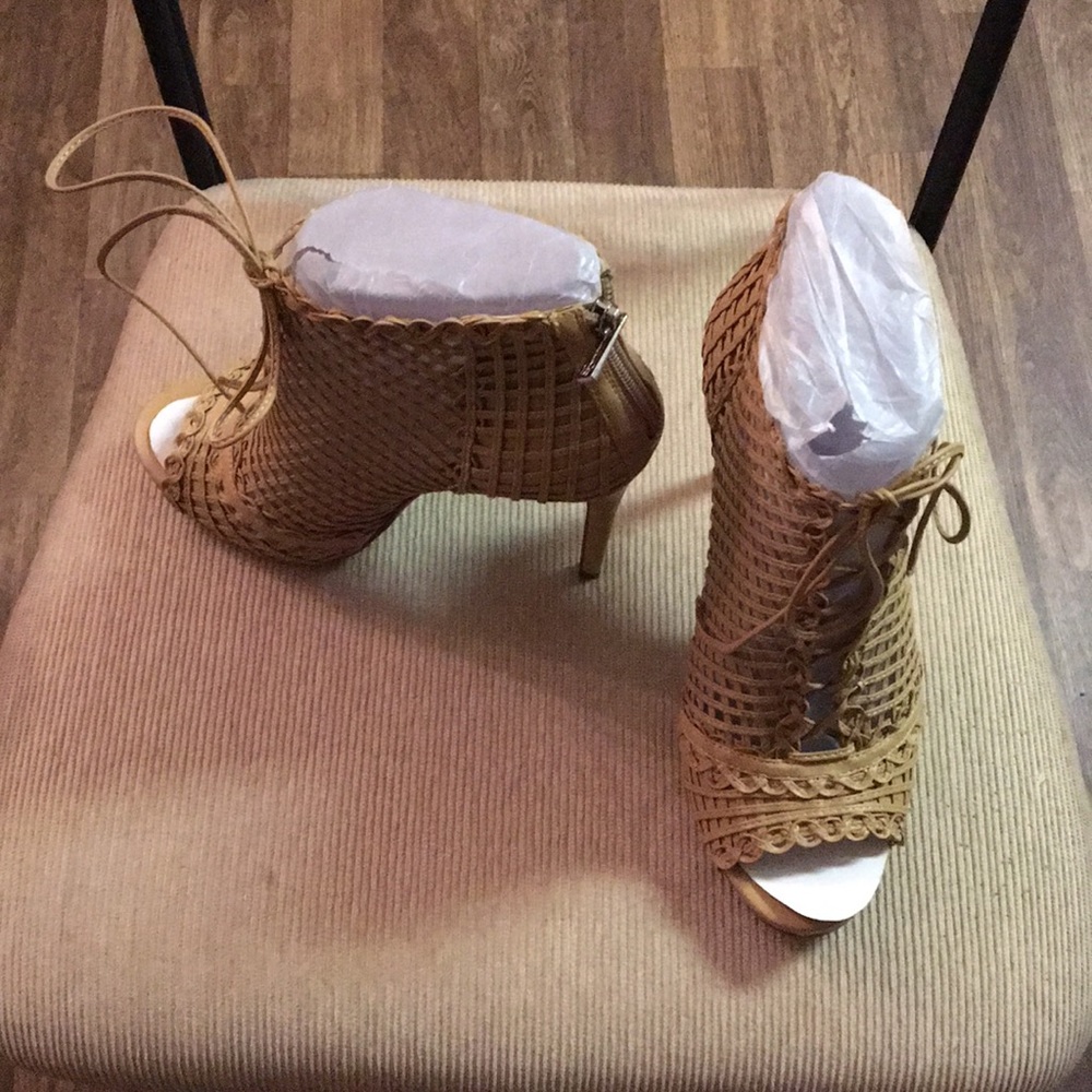 Nude colored lace up peep-toe booties